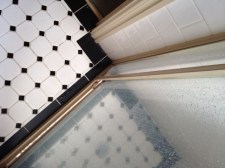 Out with grouting, tiny tiles and difficult shower doors